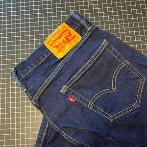Levi’s 502 style 4-way stretch deep dark blue. 33 x 30 excellent condition.